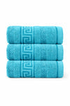 Three blue towels stacked on a white background