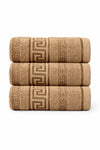 Three folded towels with a decorative pattern on a beige background